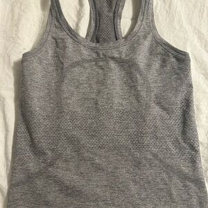 Gray Lululemon tank. Unsure of the exact size but believe it is a size 2/4.
